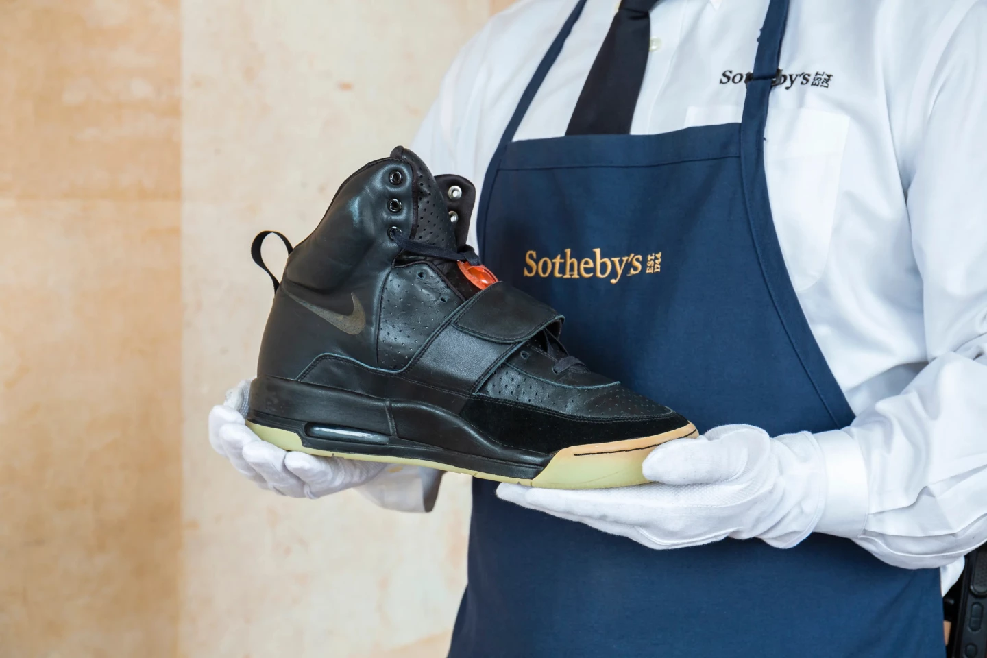 The black Nike Air Yeezy sneakers worn by Kanye West wore while performing at the 50th Annual Grammy Awards in February 2008 sold for $1,800,000 at Sotheby's on 26 April 2021