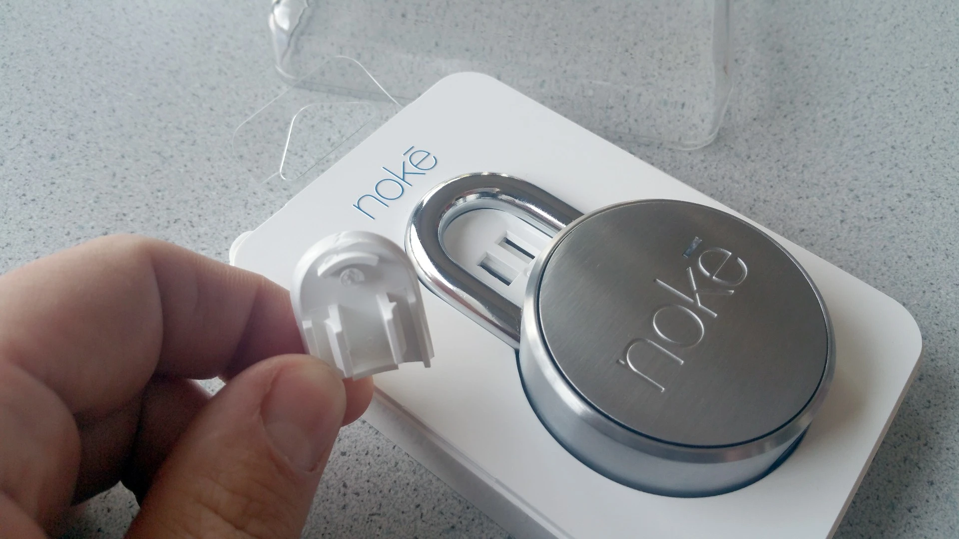 In case you're wondering, this is the plastic piece to pop out to free your Noke padlock from its packaging