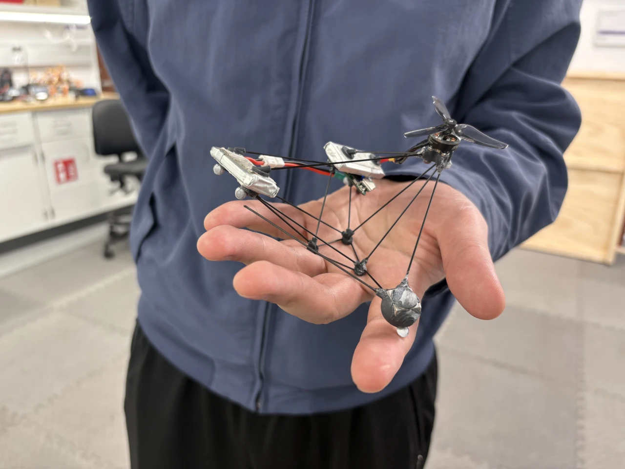 A single motor spins the propeller one way, making the whole body spin the other way - which render the drone almost invisible to the human eye in flight