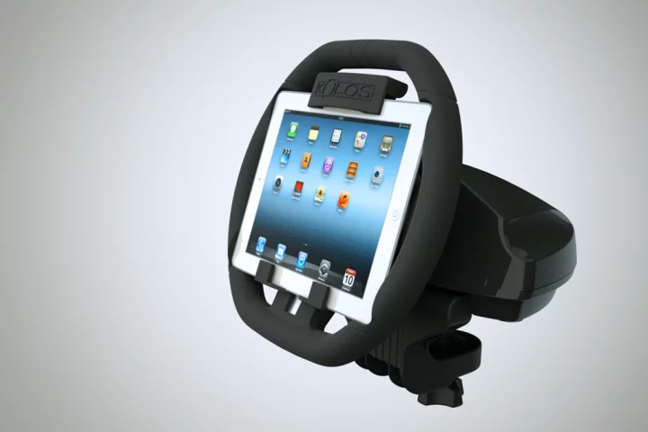 The KOLOS attaches to an iPad and turns it into a steering wheel for racing games, complete with a detachable base that attaches to most surfaces