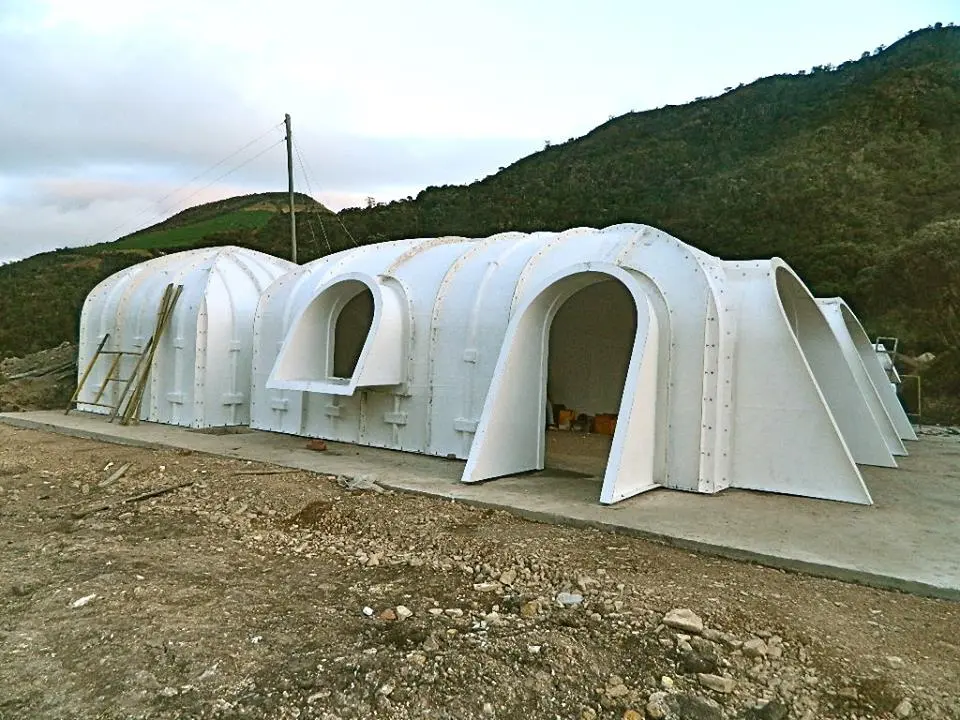 The window and door arches protrude, so they won't be covered when the soil is heaped on top