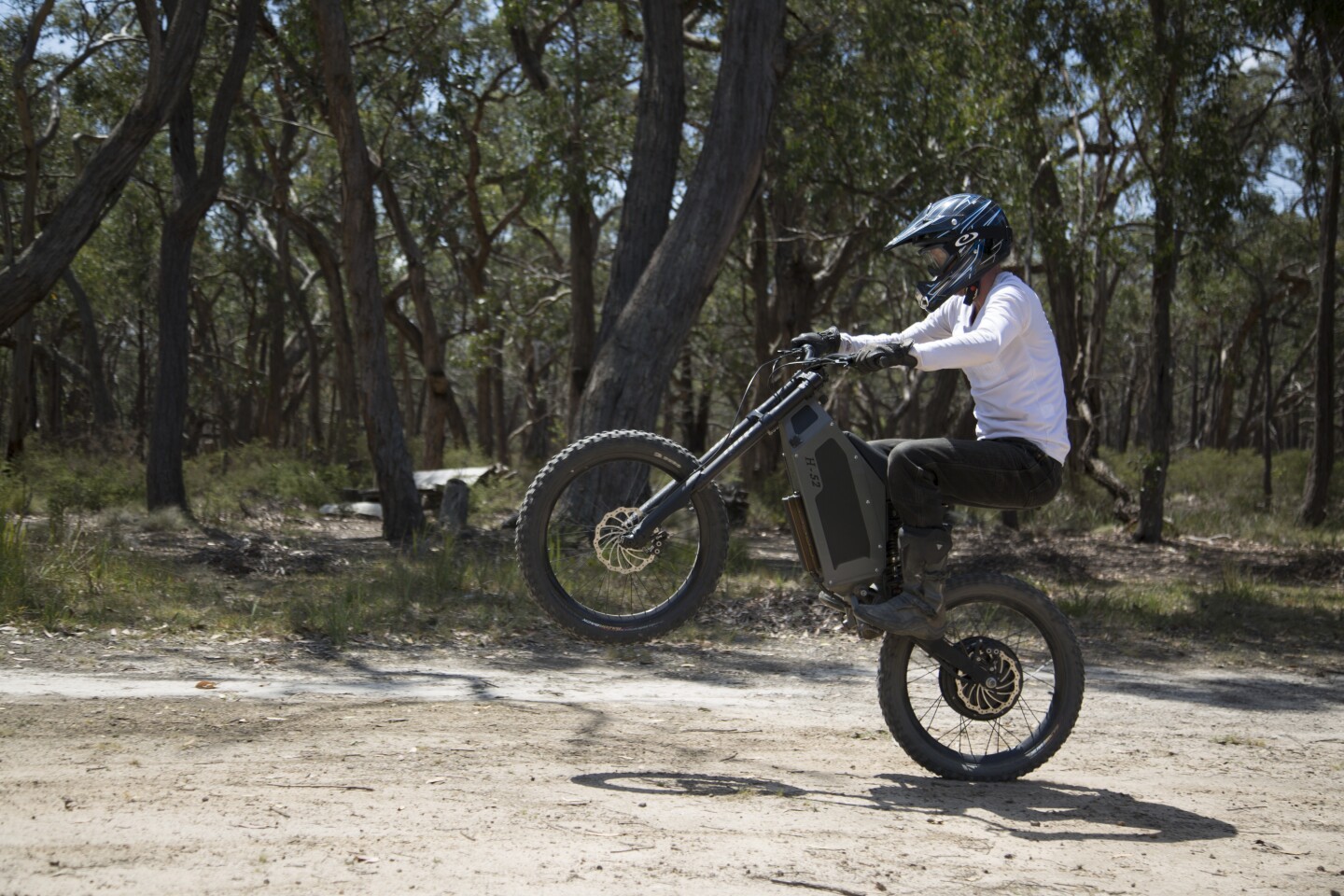 A blip of the throttle pops the front wheel up - no clutch required