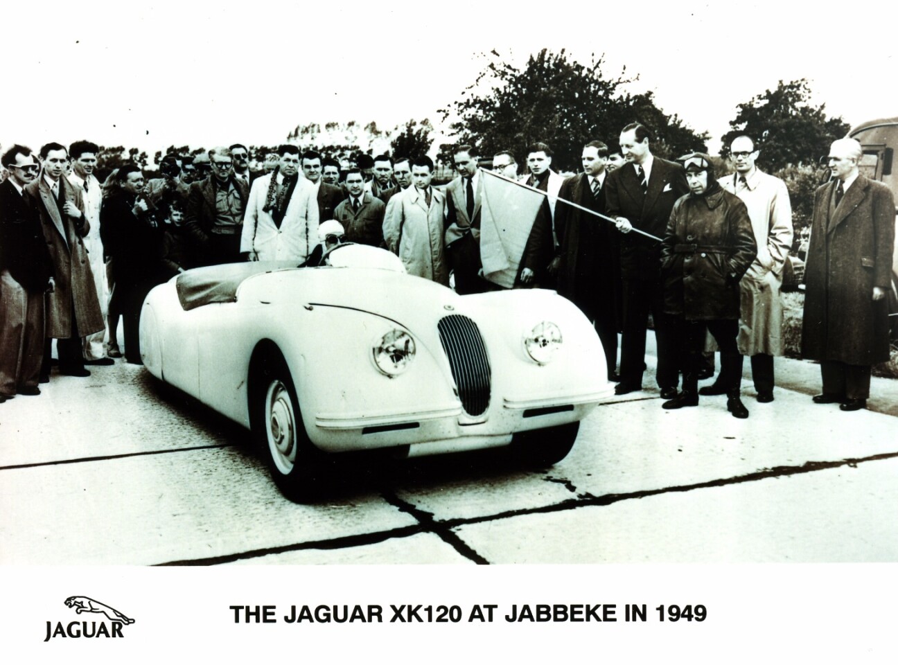 0n 30 May 1949, Jaguar took its new XK120 (the 120 represented the top speed in mph) to Jabbeke in Belgium to validate its top speed, and came away with a clear record of just over 132 mph. Loosely interpreting the meaning of "production", Jaguar removed the windshield and replaced it with a much smaller racing wind screen as well as enclosing the rear wheel opening.