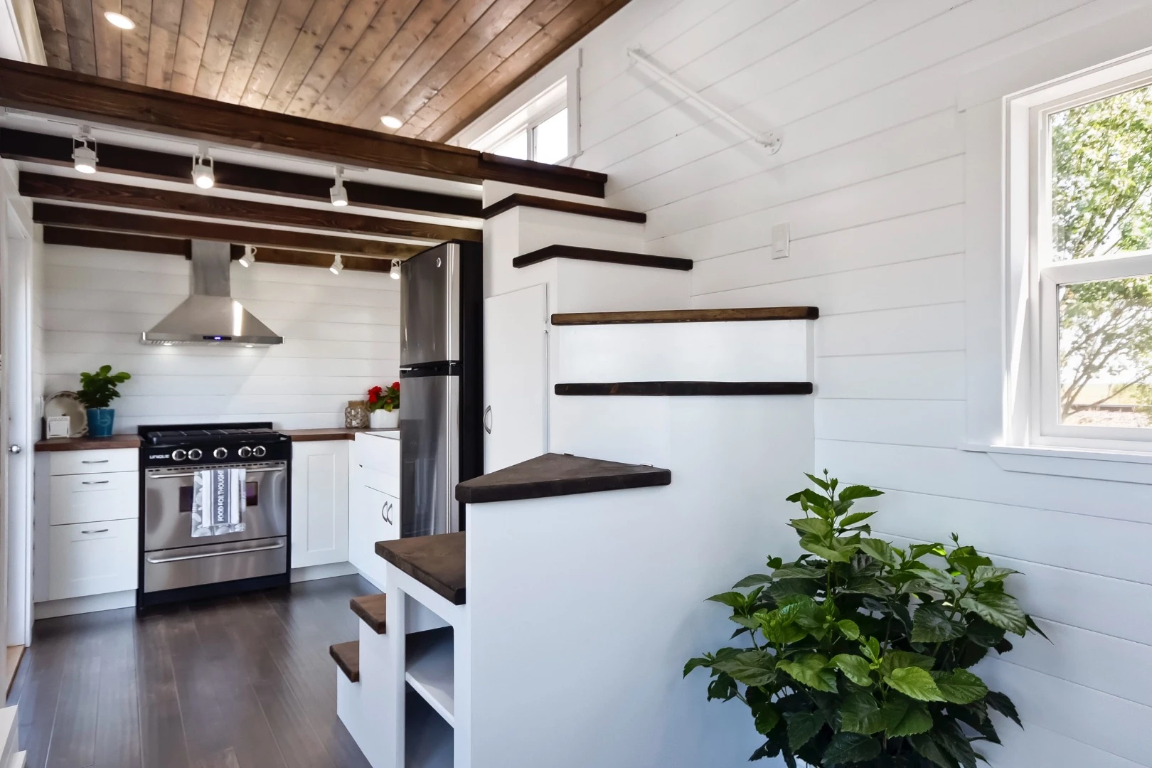 The main sleeping loft is reached by a staircase with integrated storage space