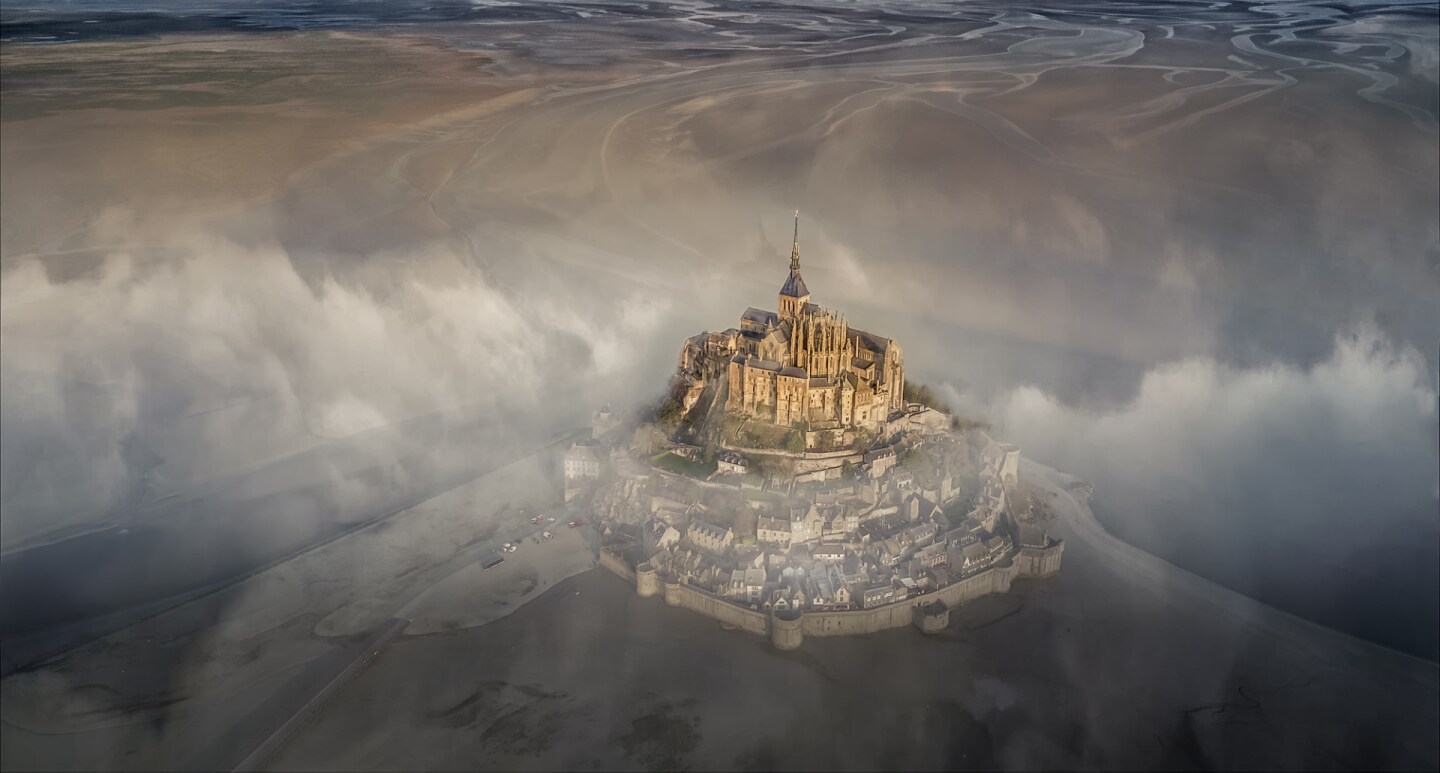 The grand prize winning photograph - the famous monastery of Mont Saint Michel during a foggy morning