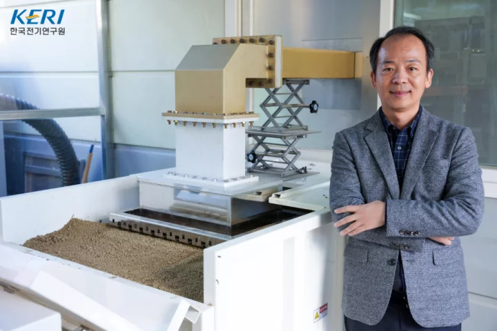 Dr. Sunshin Jung alongside his microwave soil-heating system