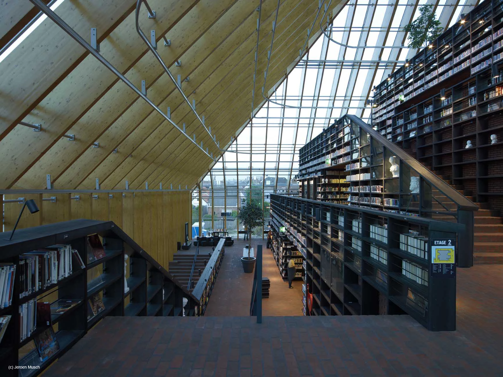 There are commercial units on the ground floor, a children's education center and chess club on the first, offices on the second, an auditorium on the third, a café on the fourth and reading tables at the top (Photo courtesy of MVRDV/Jeroen Musch)