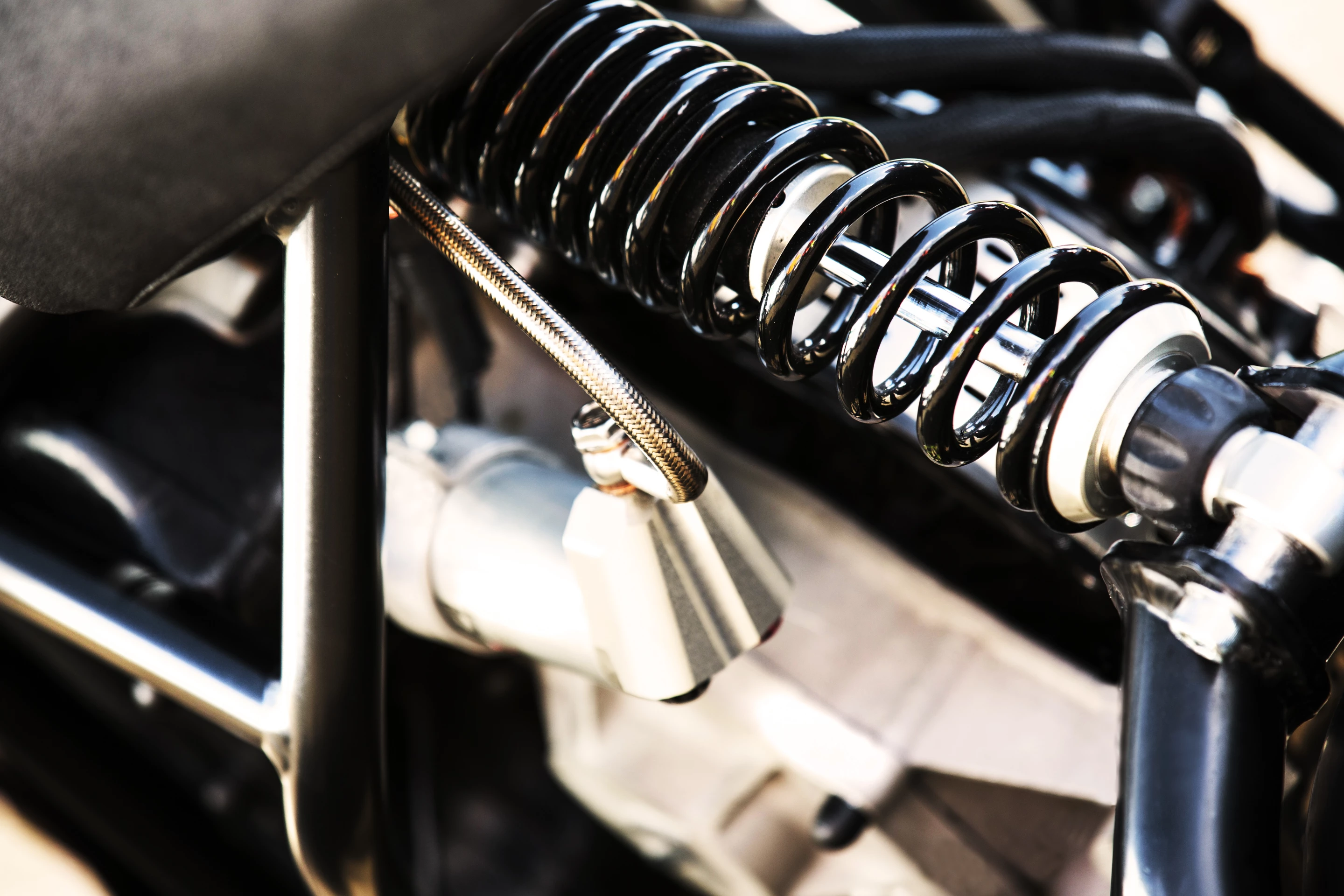 Forward suspension is provided by Agility's "Wide-Base Variable-Geometry" system