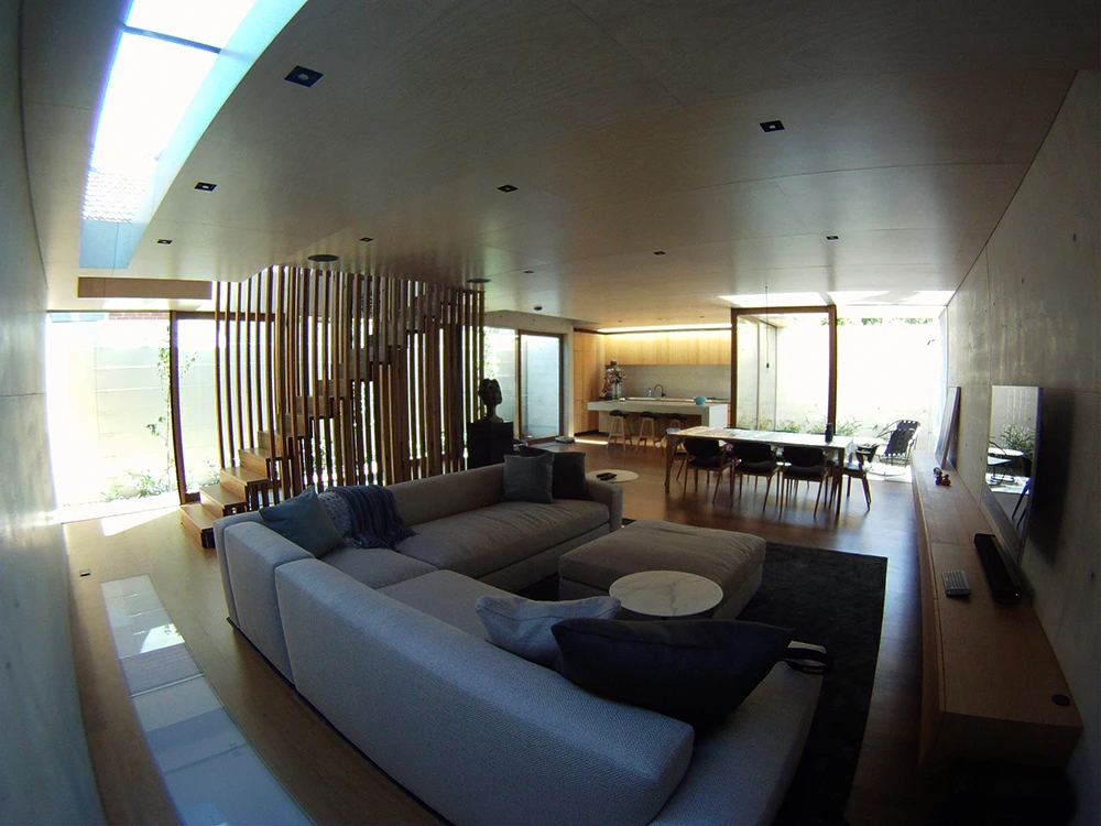 Limed hoop pine timber was used on ceilings and recycled tallowood was used for the home's interior flooring and windows (Photo: Edoardo Campanale for Gizmag)
