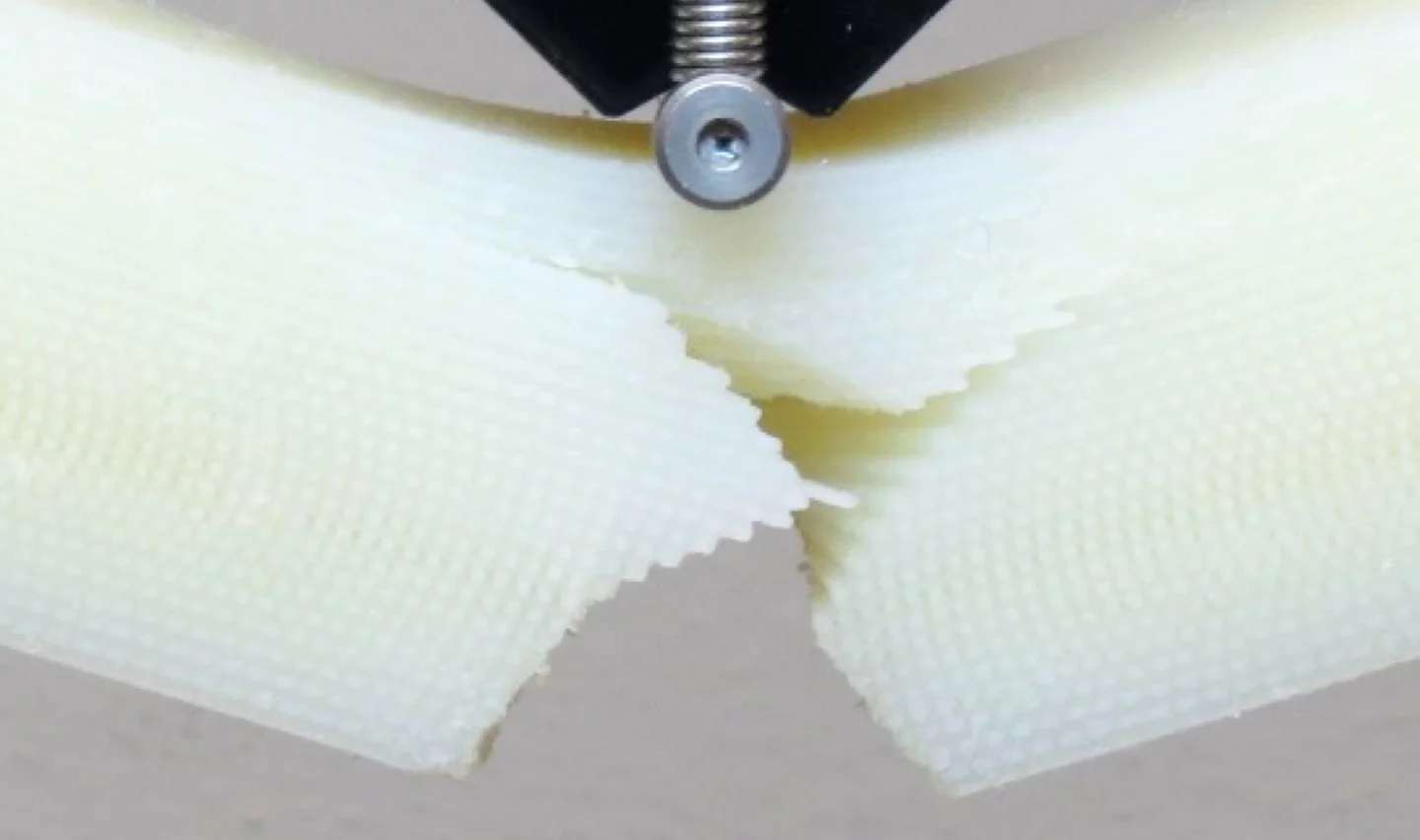 A 3D printed composite material designed to mimic the twisting crack structure of the mantis shrimp's sturdy club appendage