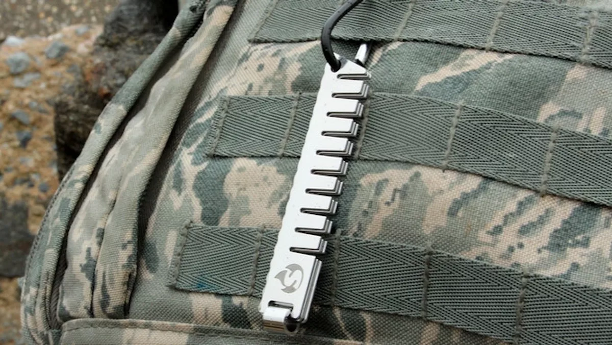 The Survival Stone Head tool also features a carabiner hook so it can be attached to a backpack of belt loop