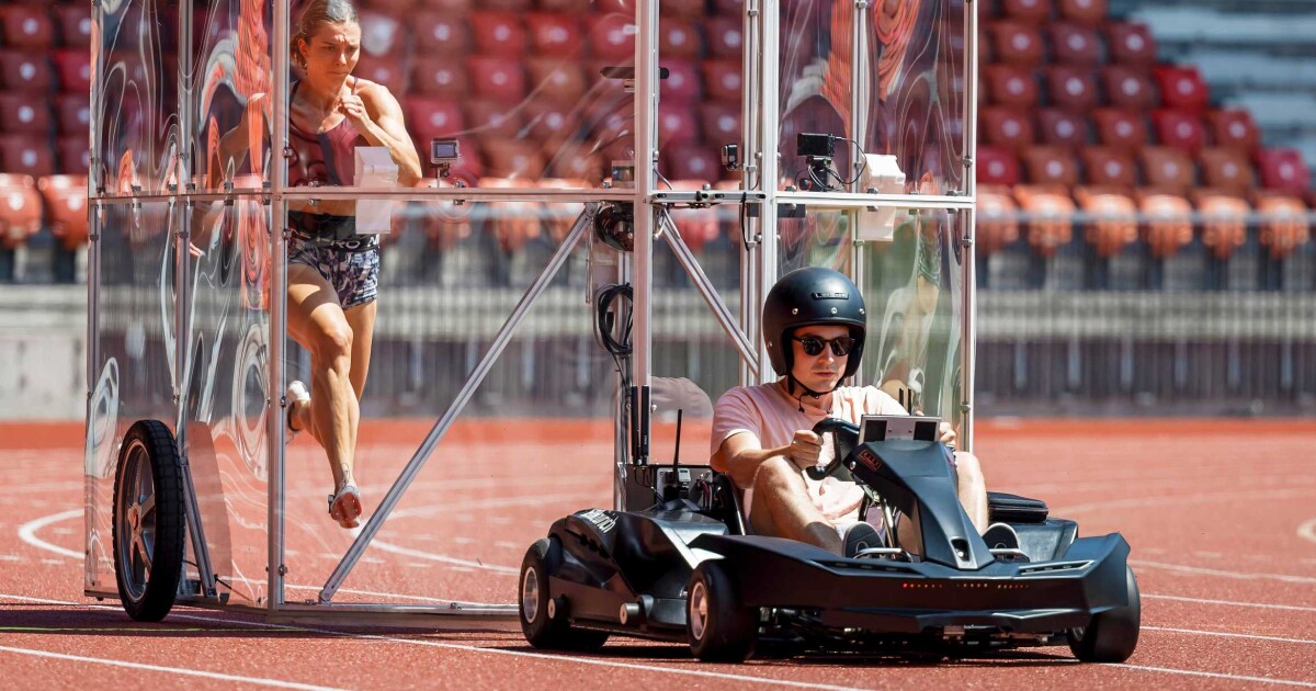 Air-deflecting shield allows athletes to run like the unimpeded wind