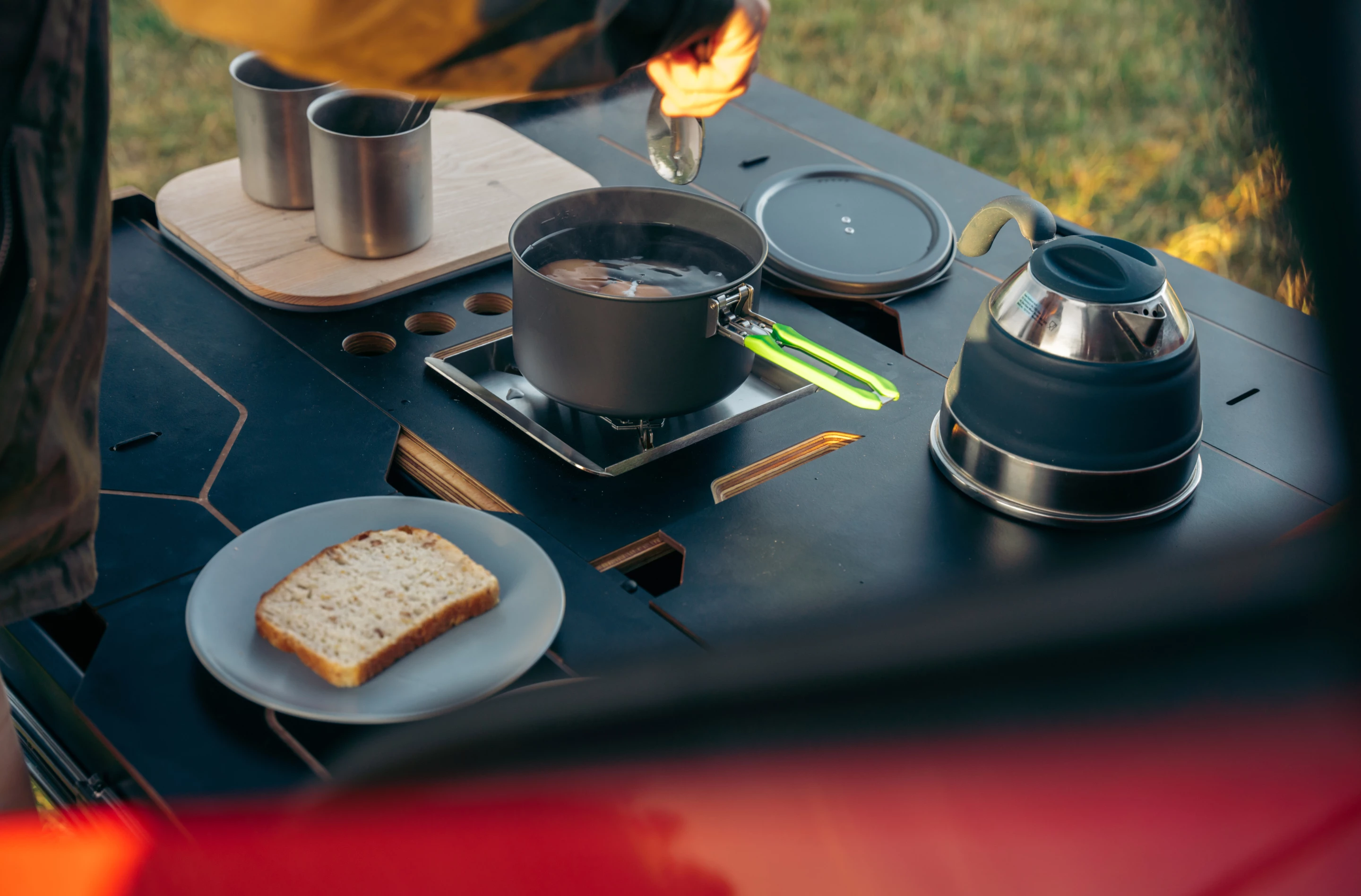 The Egoé camper kit brings a compact single-burner stove, sink with water, and fold-out bed