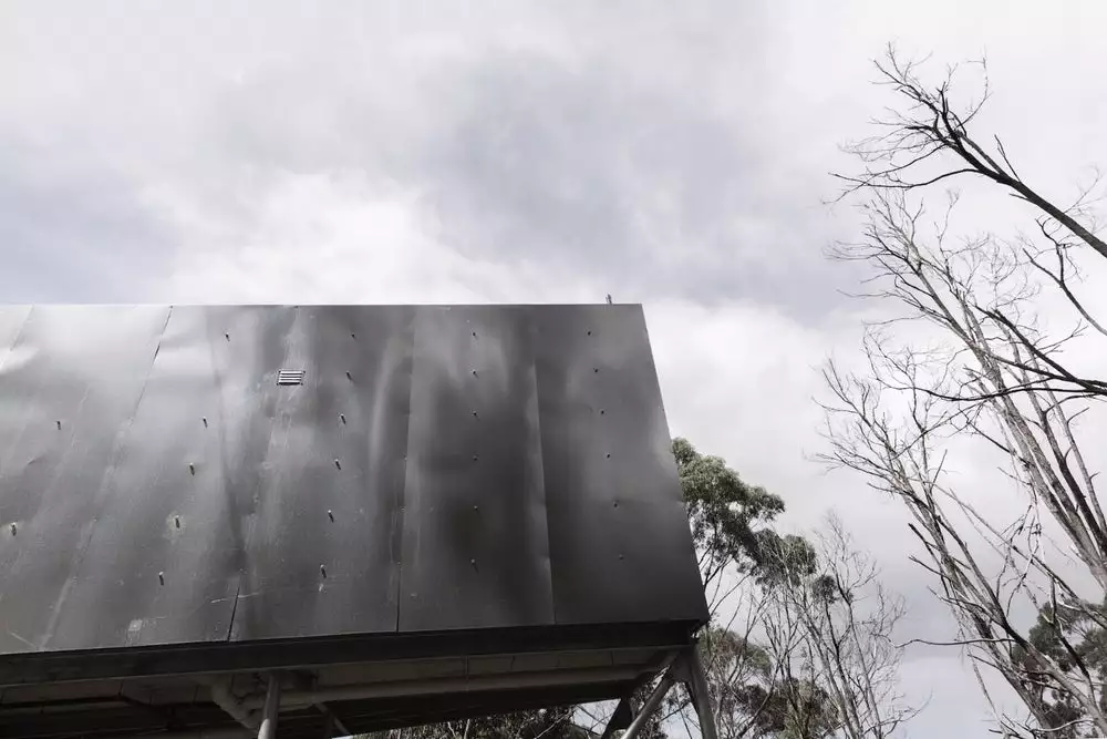 House 28's exterior is covered in insulation and clad in galvanized steel sheeting, lending it a distinctive appearance