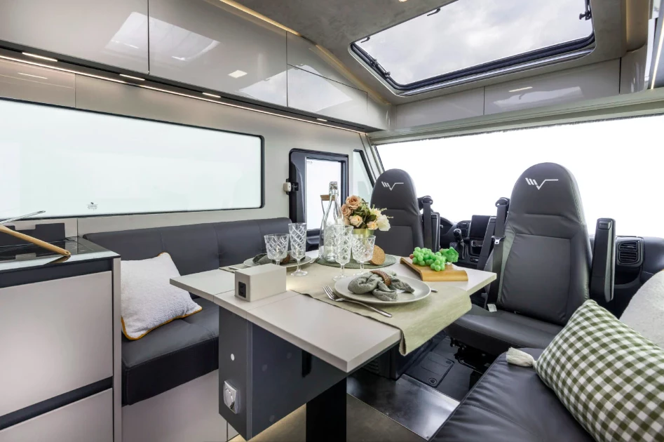 The generous seating group and electric-adjustable table create a large dining and lounge space