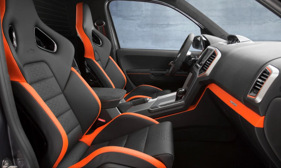 The interior includes "Orange Power" leather trim