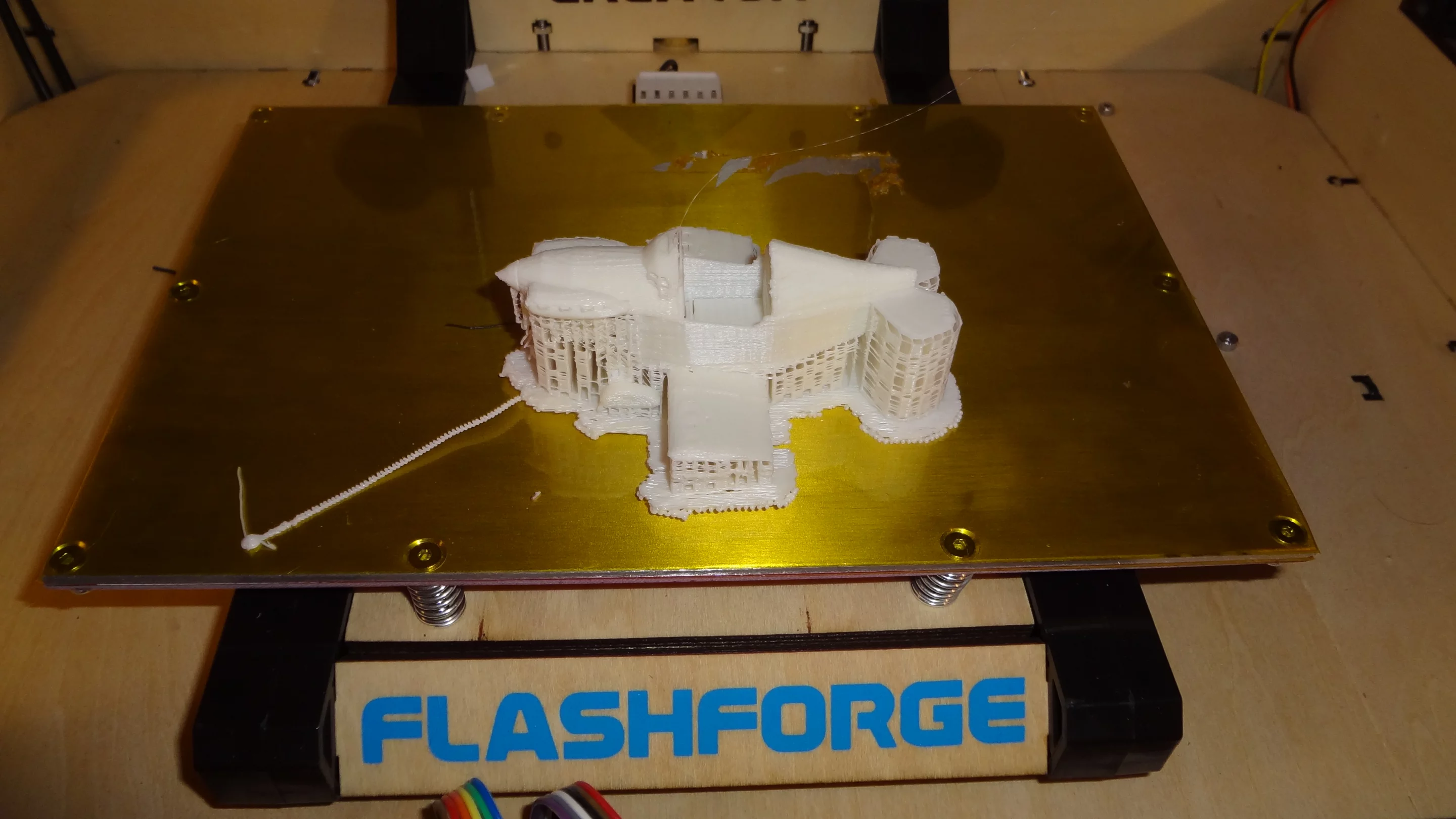 If your model can't sit on the floor of the print platform, you need to tell the software to add these supports that you see under the wings and tail of this model airplane (Photo: Gizmag)