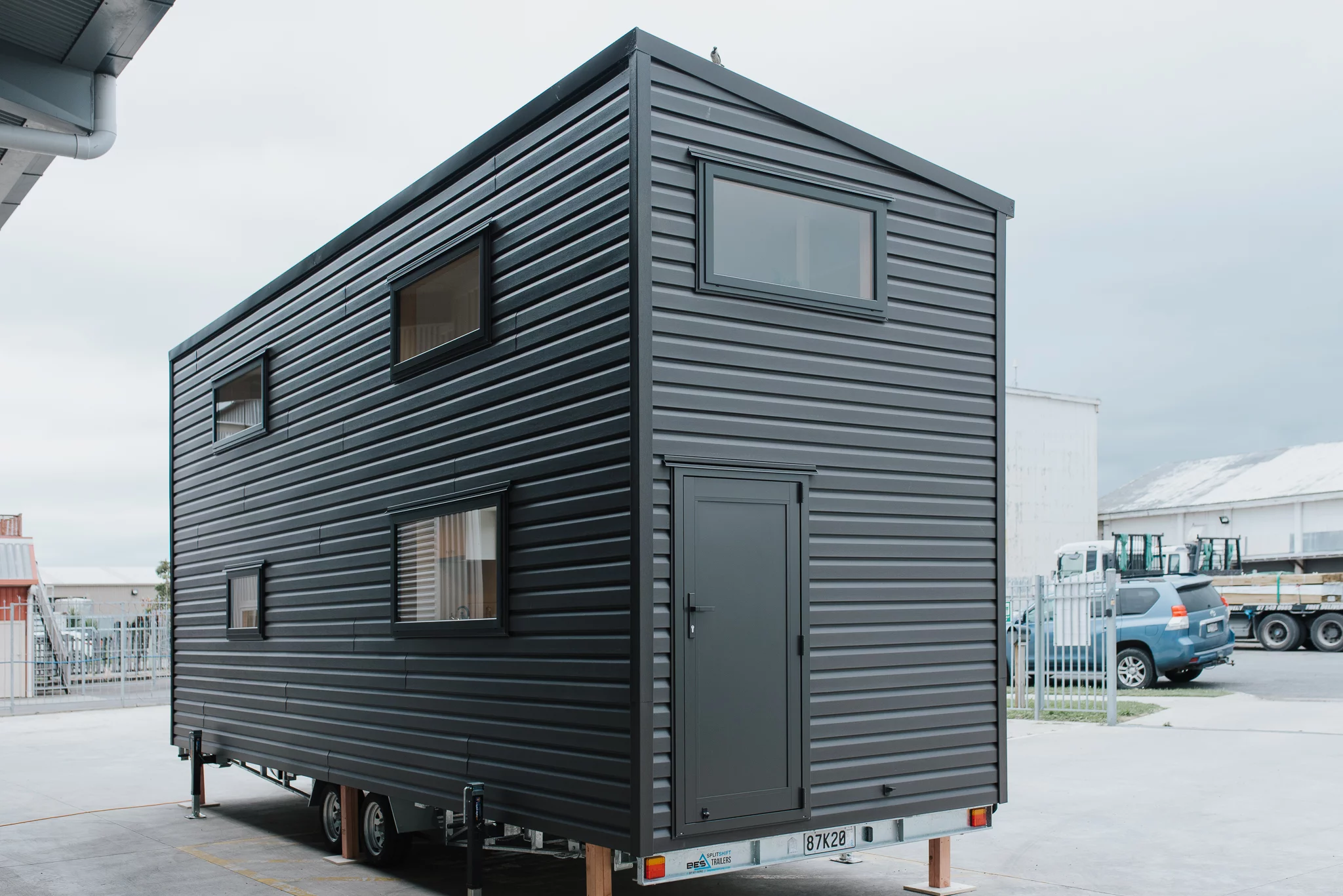 The Kererū Tiny House is finished in vinyl, with corrugated aluminum accenting