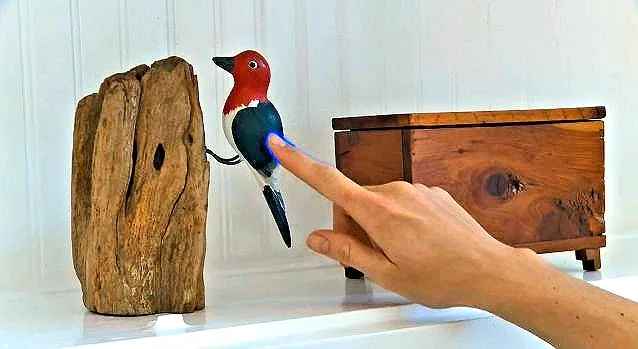 The texture of feathers can be applied to the wings of this painted wooden bird (Photo: Disney Research)