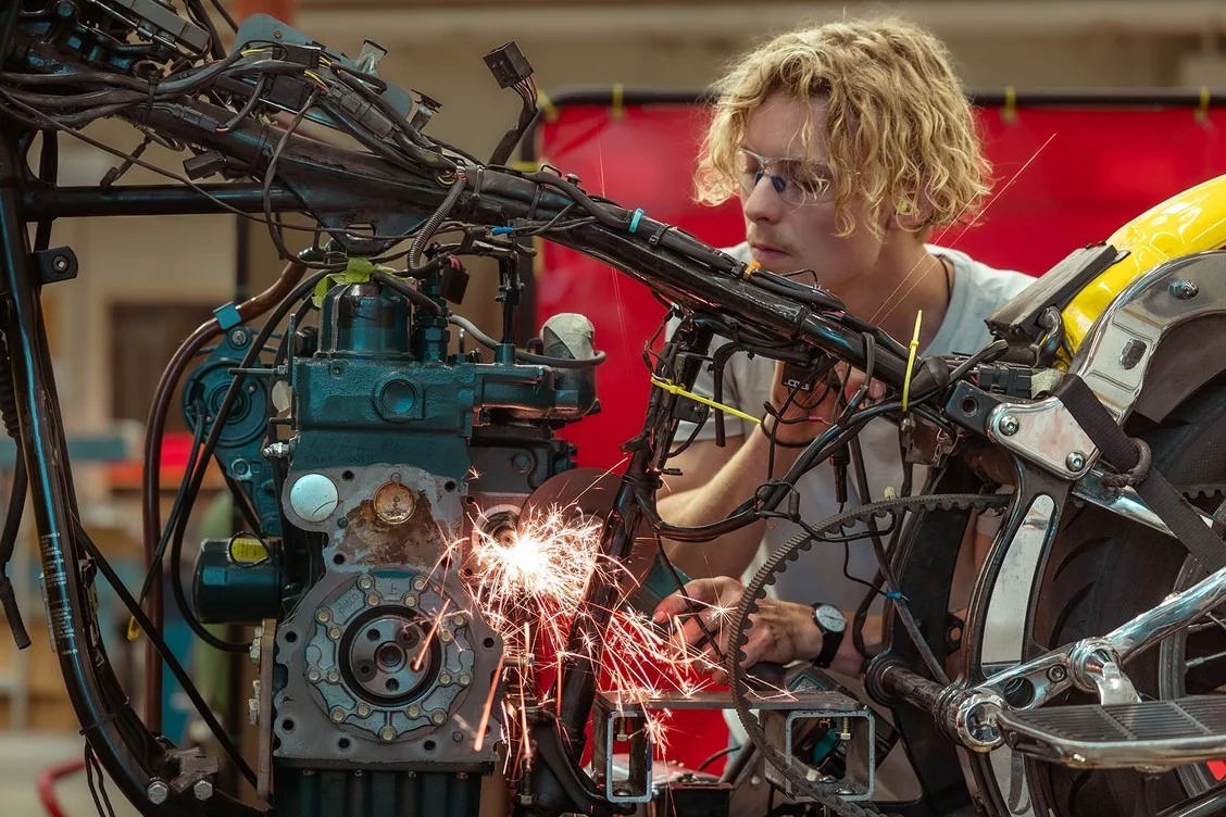 After tearing apart the bike, the first step was to install a three-cylinder Kubota tractor engine that traditionally runs on diesel