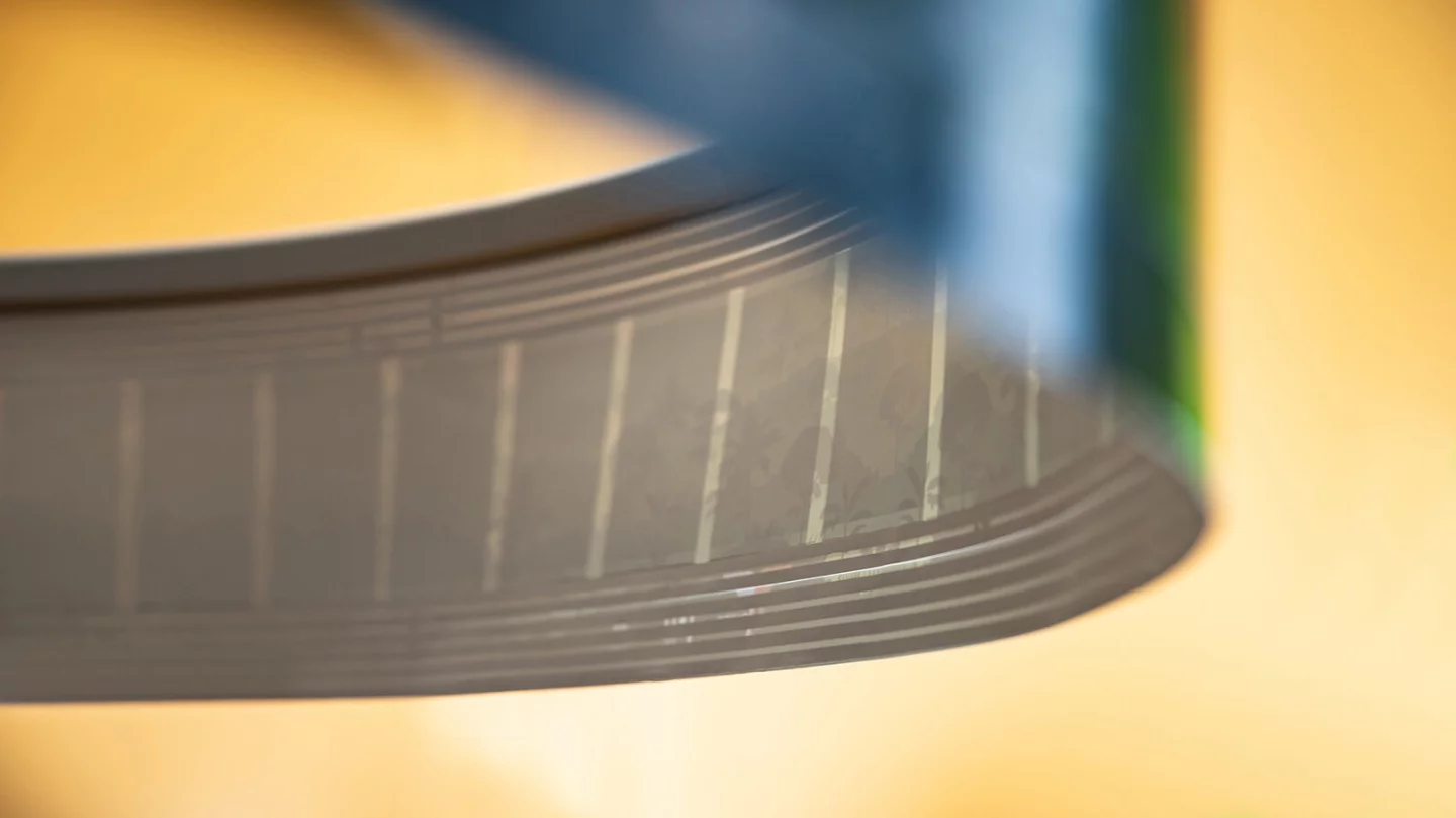 The printed speakers are embedded almost invisibly in the paper web but can be seen with strong backlighting