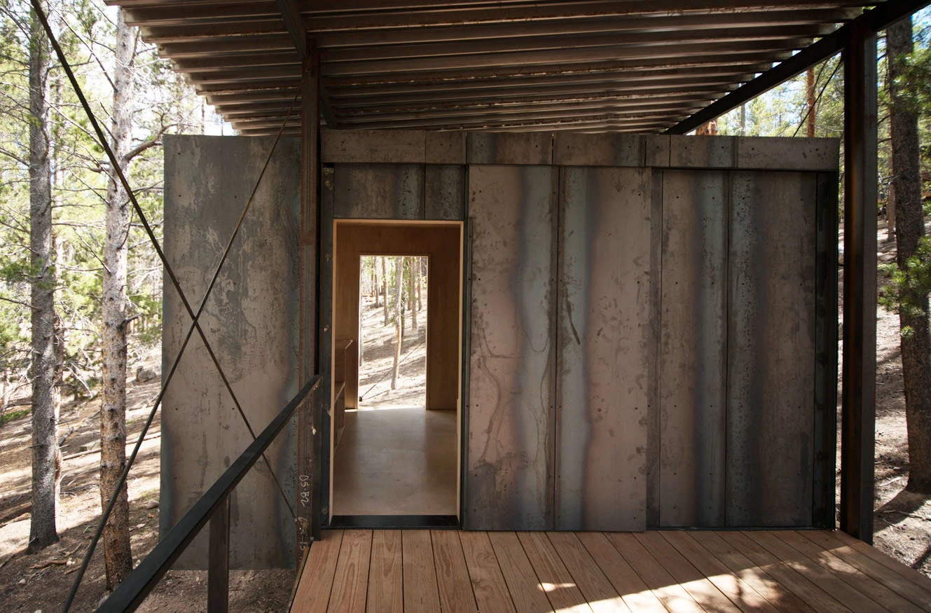 The cabins are based on a steep hill within a Lodgepole Pine forest