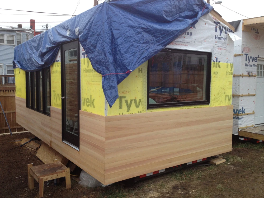 Construction process – cypress siding installed (Photo: Paul Burk Photography)