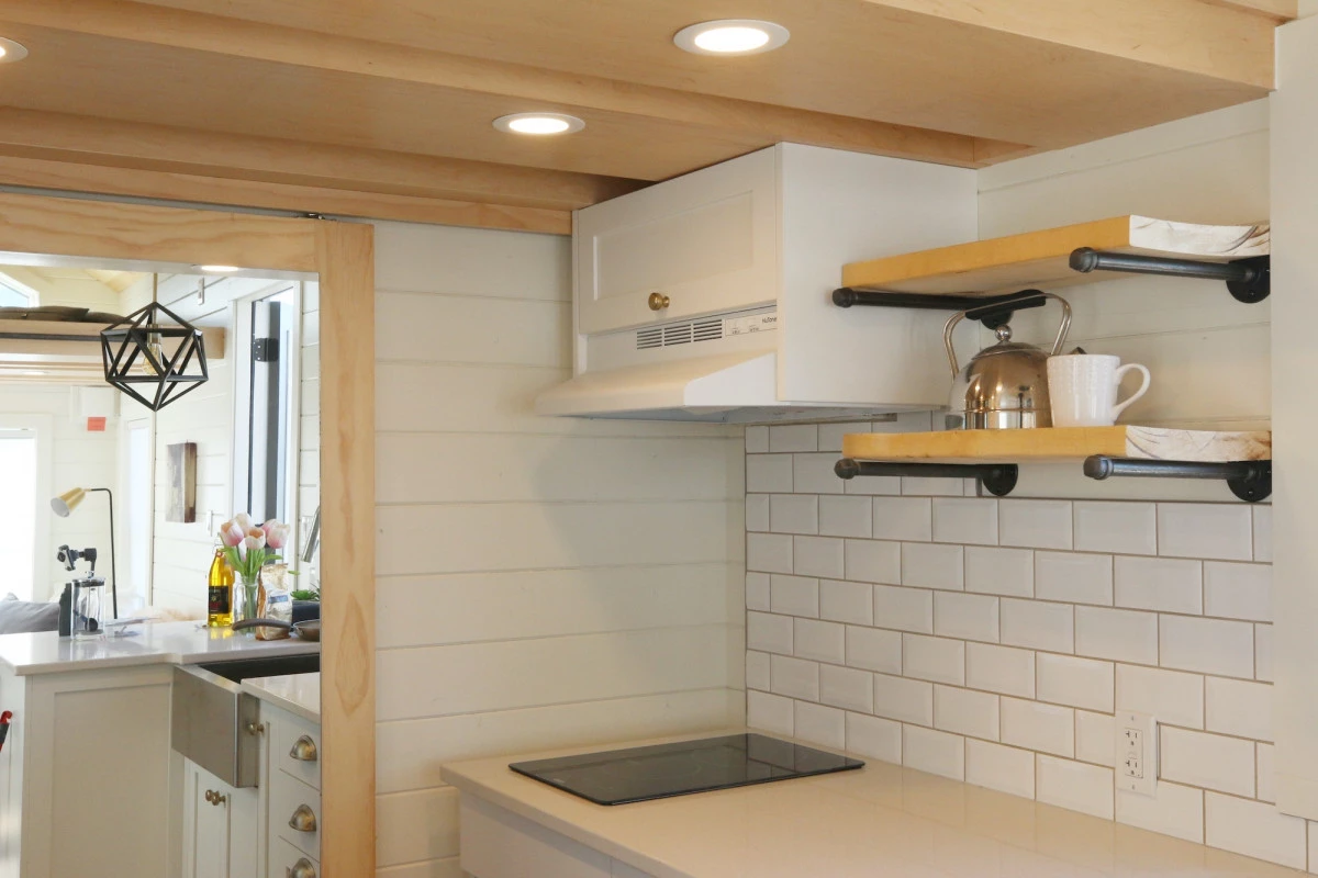 The Innisfree Anarres' kitchen features shelving and cabinetry for storage