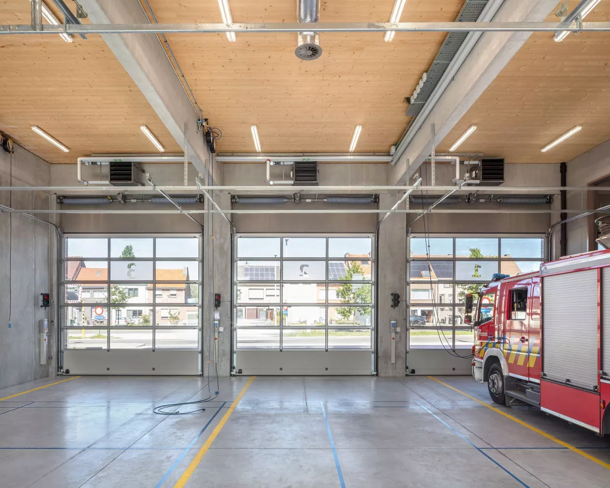 Fire Station Wilrijk's interior features a large garage space on the ground floor