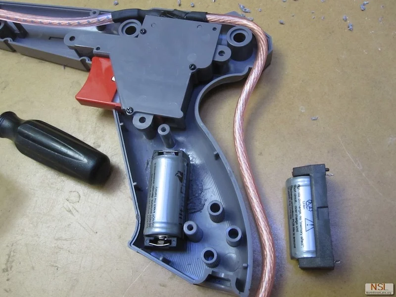 The basic components used to make the NES Zapper Laser included batteries, a 445 nm diode, lens, key switch and heat-sink