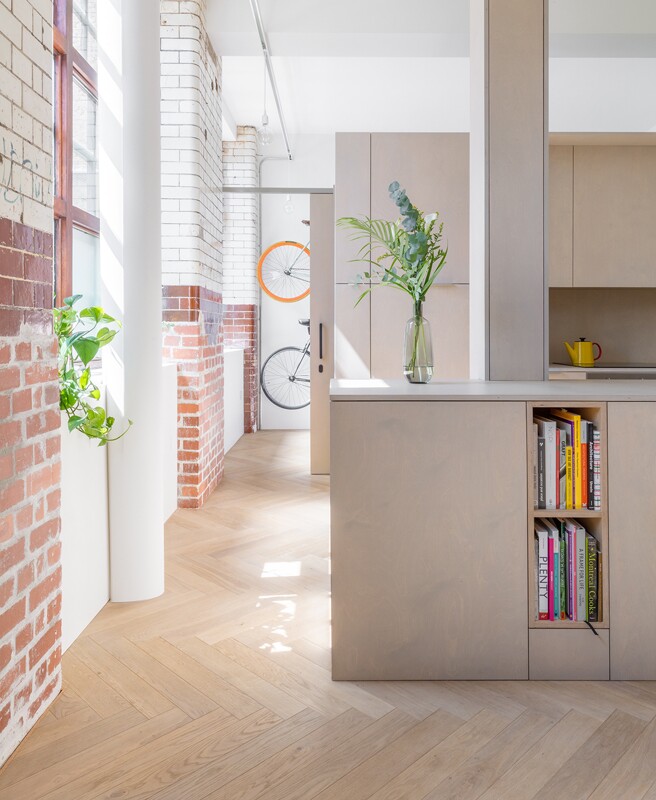 As an additional aesthetic consideration the architects chose to enhance the home's biscuit factory features by exposing the original brick work