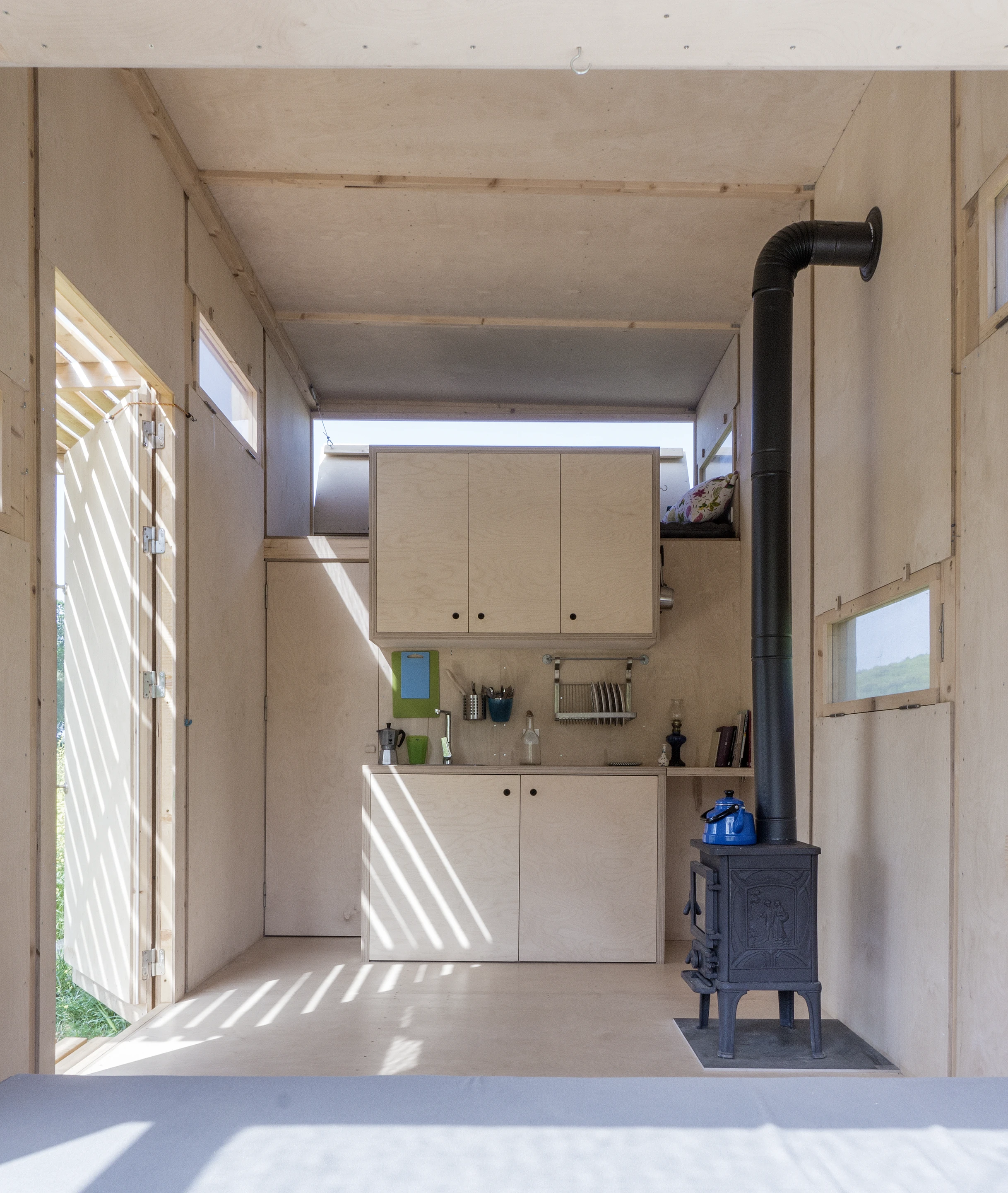The Cabin on the Border is heated with a wood-burning stove