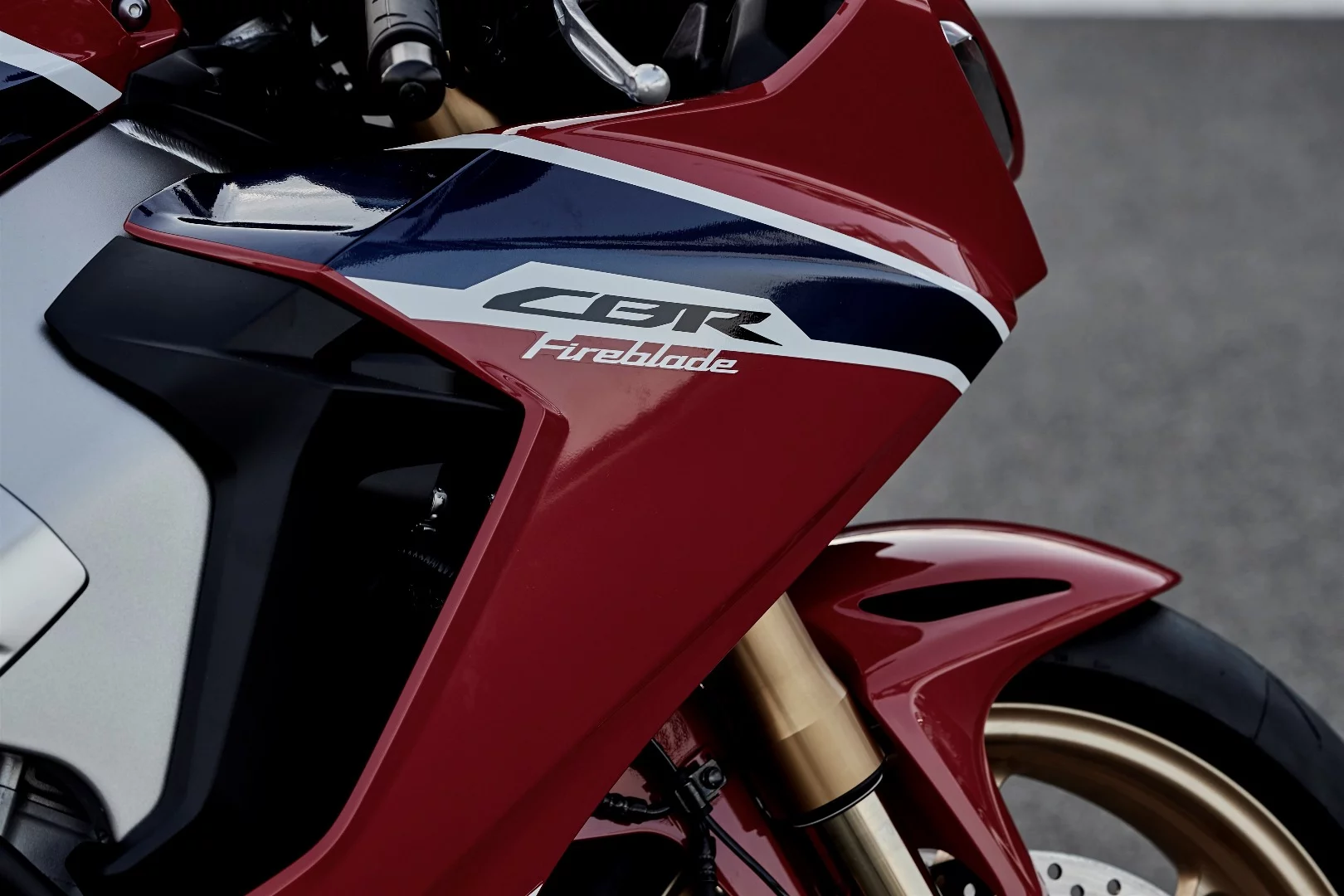 If the logo sits on white background stripe, then it's the Honda CBR1000RR Fireblade SP. If it's gold, then you're looking at the SP2