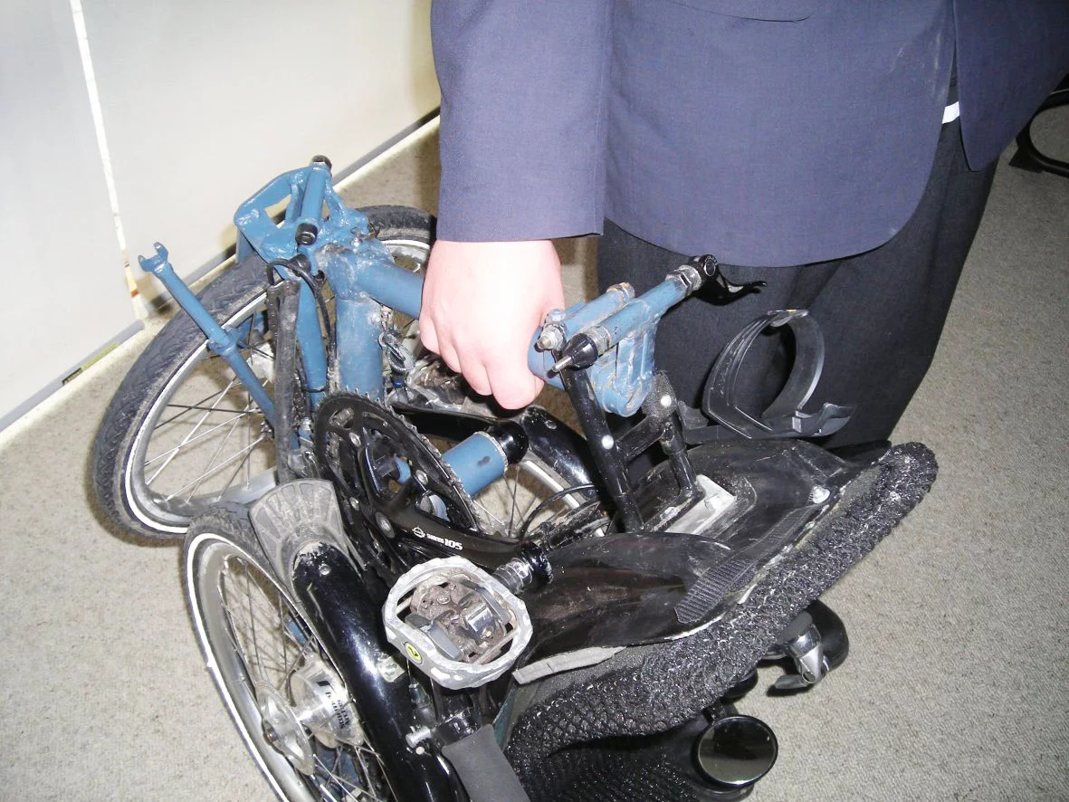 The Evolve trike, being toted after folding
