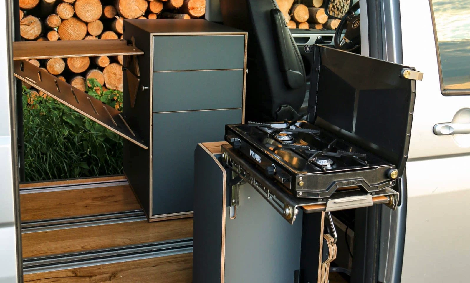 Ready to cook on the dual-burner Primus Tupike atop Babum's versatile mini-kitchen