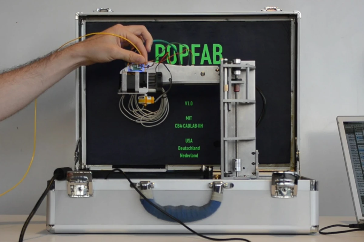 Two MIT students recently developed the PopFab, a machine that does 3D printing, milling, vinyl cutting, and drawing, all while fitting inside a small suitcase