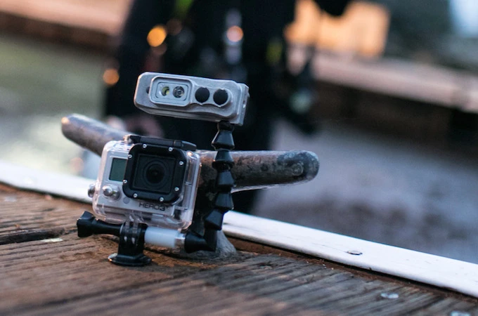 An optional flexible arm allows it to be mounted above the GoPro
