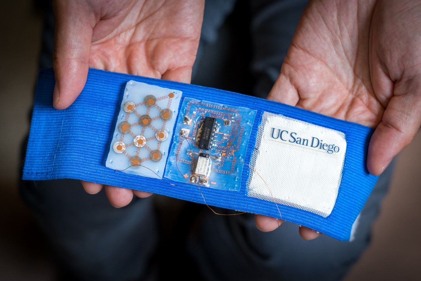 The proof-of-concept armband features a flexible battery, a stretchable circuit board, and a patch made up of thermoelectric alloys sandwiched between elastomer sheets