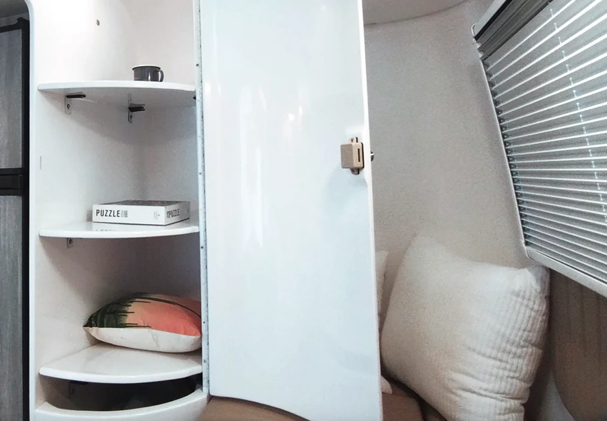 While a nice addition, the new cabinet also boxes in the dinette chair and opens up over top of it, making things a little more cramped inside