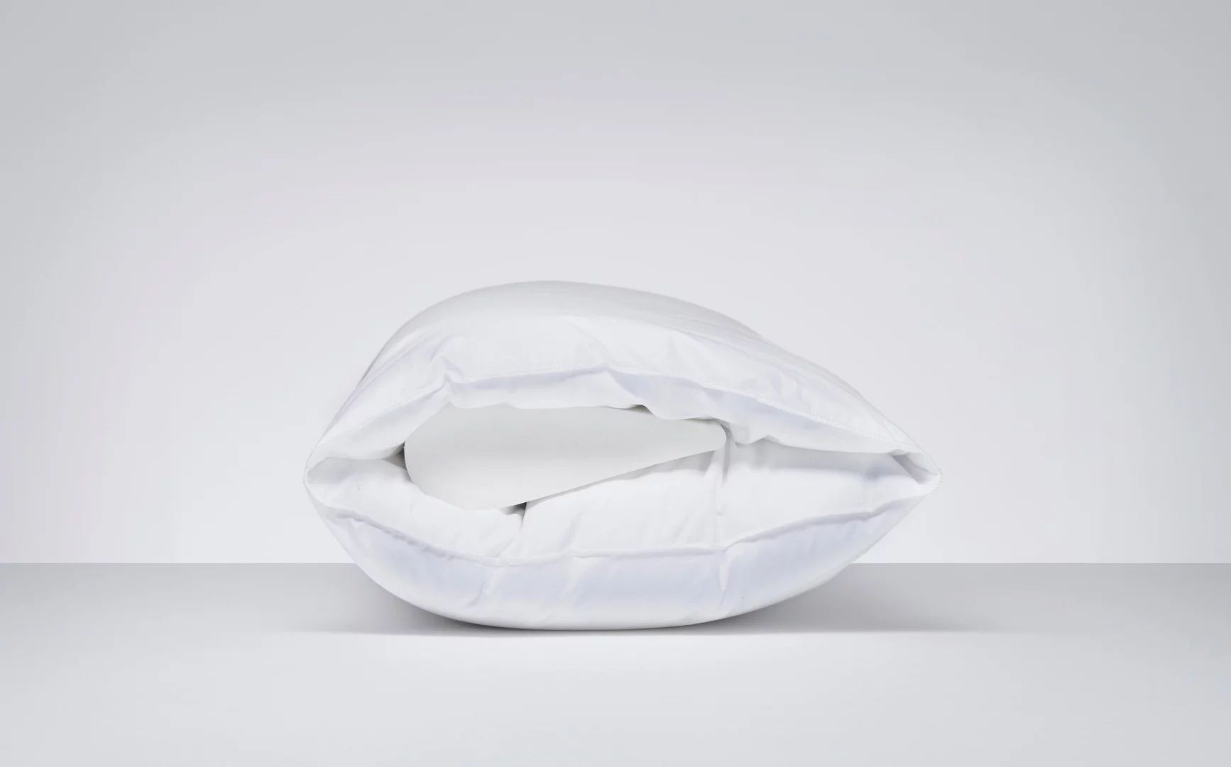 The Wopilo works by having a memory foam core closer to one side than the other