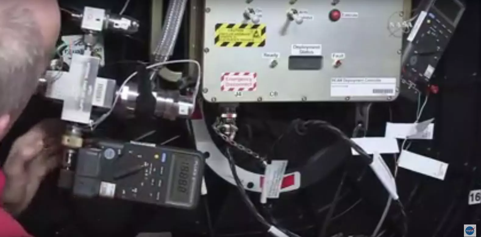 Astronaut Jeff William's lettgin air into BEAM