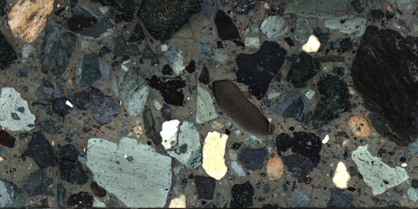 A section of the drilled rock sample taken from the Chicxulub crater, showing different types of rock that were washed into the crater following the impact