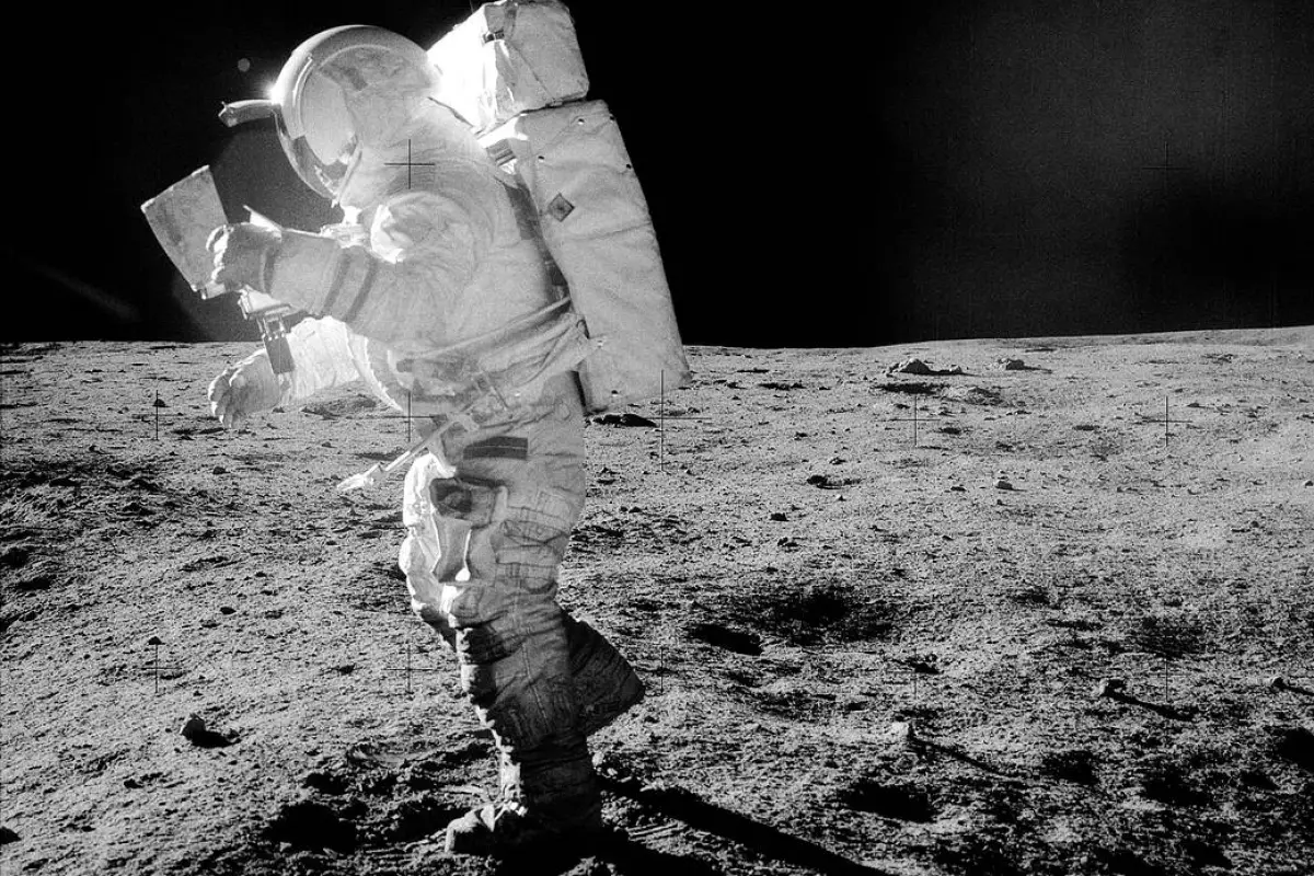 Astronaut Edgar Mitchell pictured walking across the Moon's surface in a spacesuit contaminated by lunar regolith