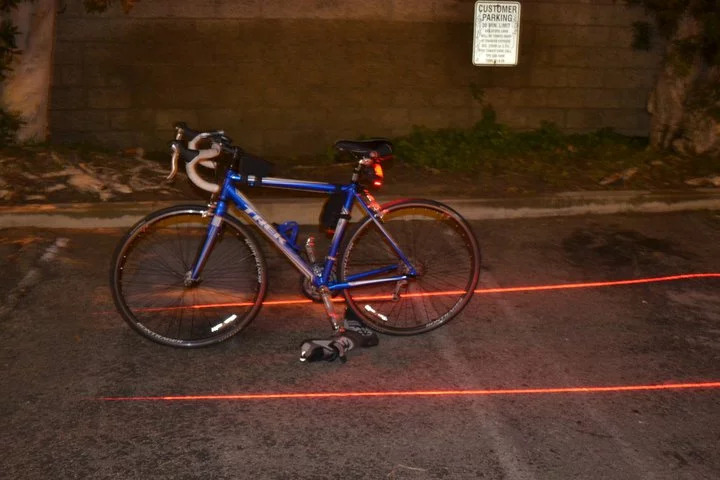 Xfire’s Bike Lane Safety Light incorporates two 5-milliwatt red lasers