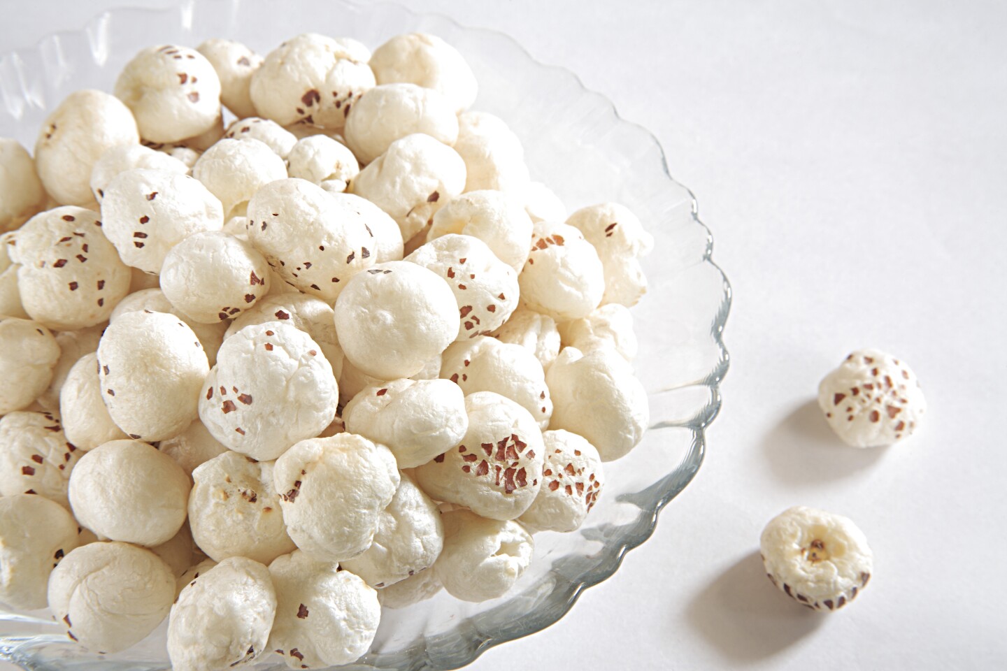 Light, puffy 'popped' fox nuts have the texture of popcorn, without the grits that get stuck in your teeth