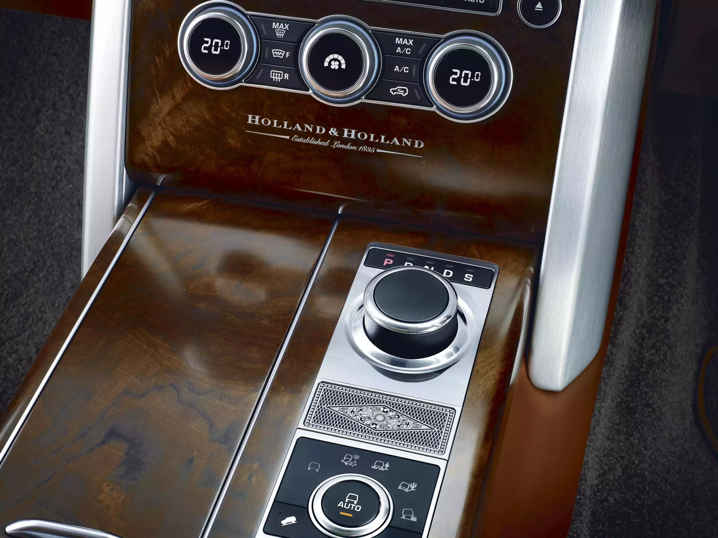 The Holland & Holland Range Rover Has a walnut veneer console