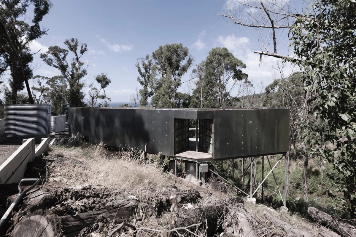 House 28 comprises three 20 ft (6.1 m)-long containers clad in galvanized steel