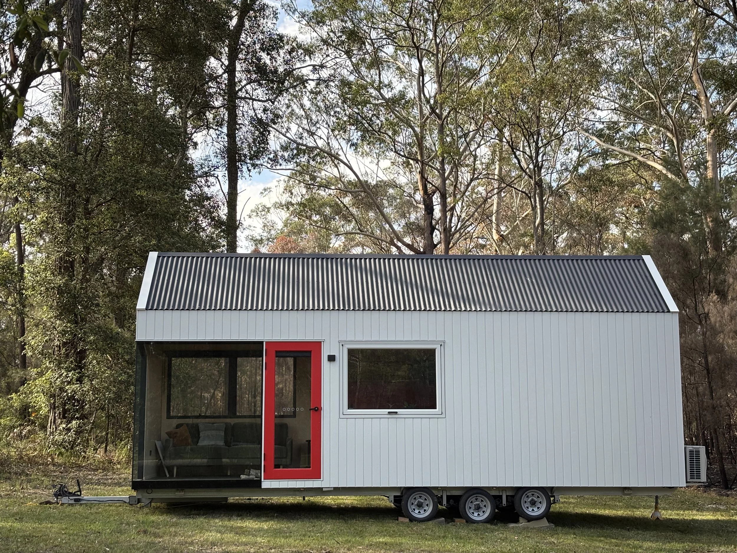 The Eire is a two-person tiny house that has very generous glazing, putting the focus on maximizing daylight and views