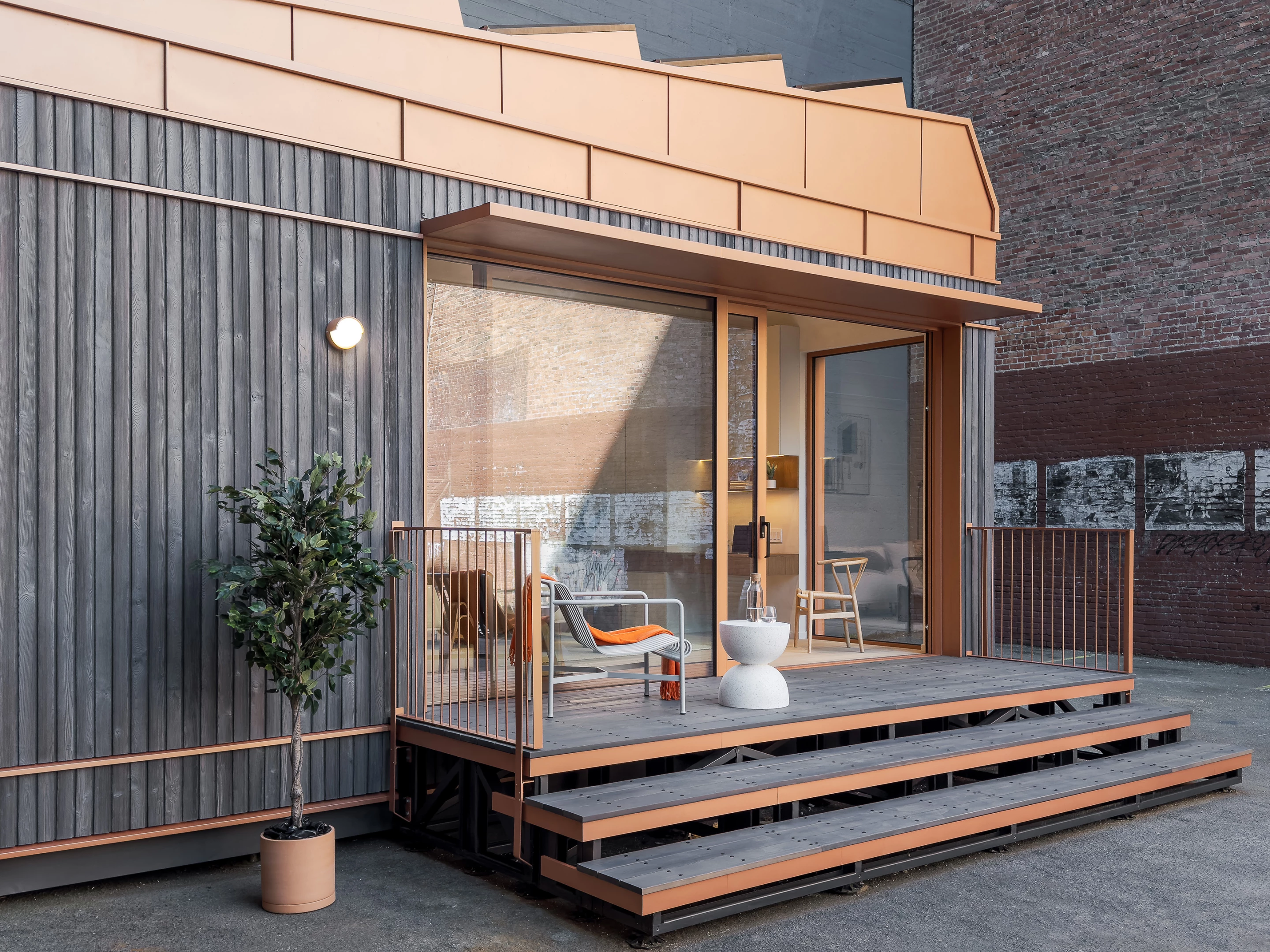 The Cosmic One includes a small deck area and is accessed by some steps
