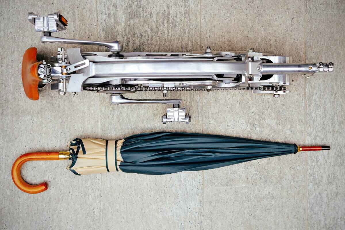 The folded bike (minus the wheels) is about the size of an umbrella